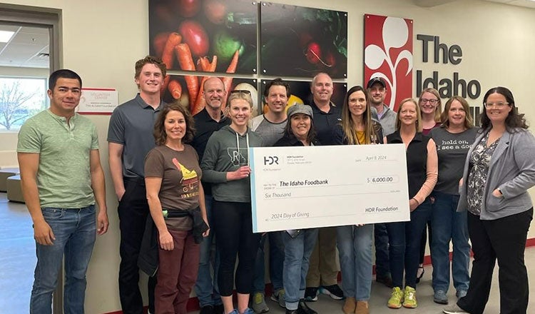 Employees from HDR's Boise office deliver a check to The Idaho Foodbank. 