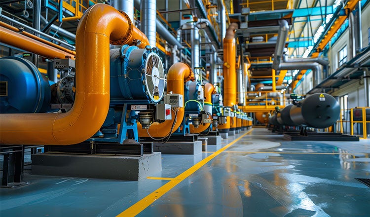 Air to water heat pumps on a factory floor.