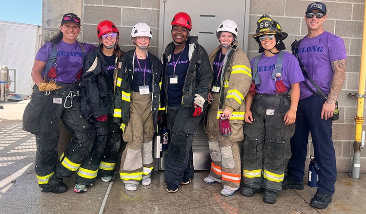 Girls take part in a fire training camp