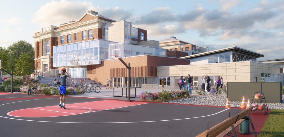 Architectural rendering of a high school with a new, glass addition connected to the original brick building. A student plays basketball on an outdoor court