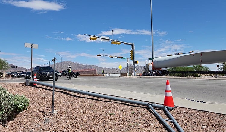 A wind turbine blade navigating the Artcraft Road intersection.