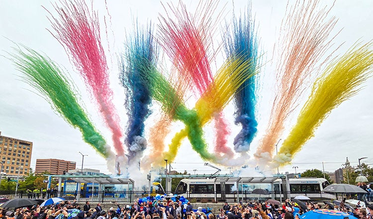 Kansas City Streetcar Extension grand opening celebrated with colorful smoke in the air